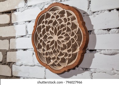 The Layers Of The Mandala Are Cut From A Tree By A Laser