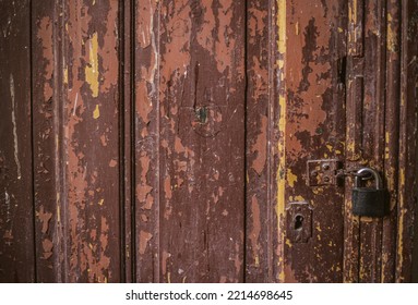 Layers Of Old Paint On Wooden Door And The Lock