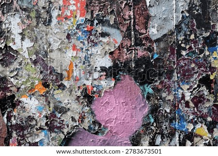 Layers of paint peeling off a wall