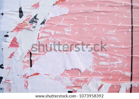 Layers of ripped off wall posters, torn street billboard banners, parts of existing images