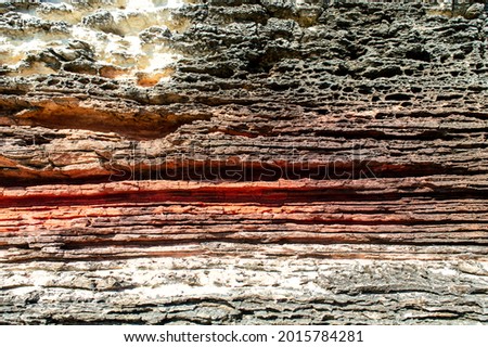 Layers of sedimentary sandstone rock. rock formations in red, white and gray. structure background