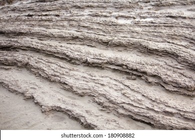 Layers of silt on Mersehead Sands, RSPB Mersehead Nature Reserve, Southwick, Dumfries and Galloway, Scotland, UK.