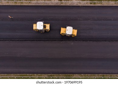 Laying Of Asphalt. Asphalt Rollers Level And Seal The Layer Of Asphalt Concrete Mix.