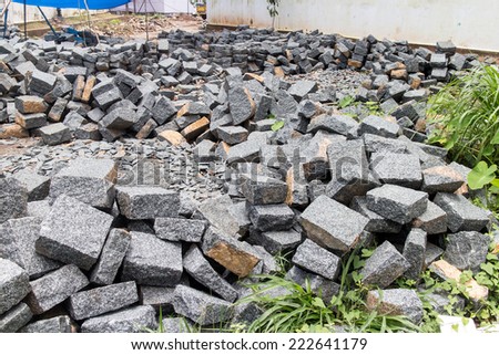 laying of bricks on path way. Bricklayer paving a street. obblestones, pavement construction
