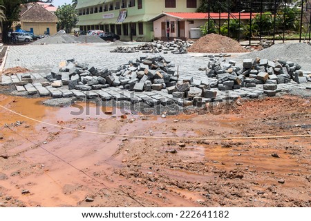 laying of bricks on path way. Bricklayer paving a street. obblestones, pavement construction