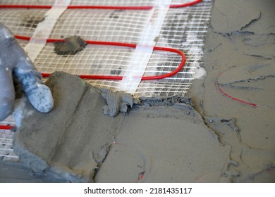 Laying An Electric Underfloor Heating Under A Cement Screed Close-up