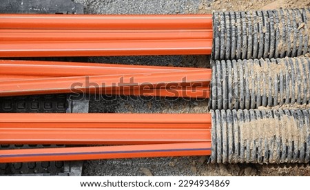 Laying of empty conduits for fiber optic cables