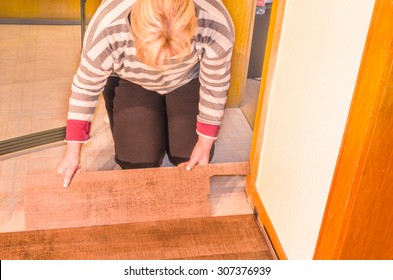 Laying Of Floor Covering. Here Processing Of Vinyl Laminate Floor In The Old Building.