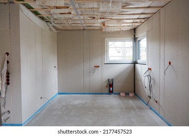 Laying Fresh Screed On The Floor Of A Kitchen In A New Build House