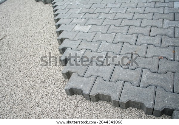 Laying interlocking paving. Master laid\
interlocking paving. Professional paving of interlocking paving.\
Laying tiles on the terrace,\
parking.