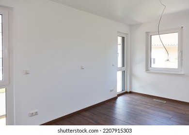 Laying New Dark Flooring By Floor Layers When Building A House In The Room