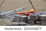 Laying paving stones. Paving tools for use.