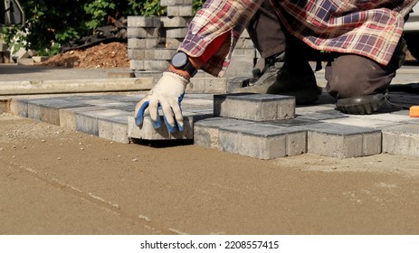 Laying Paving Stones. Paving Works.