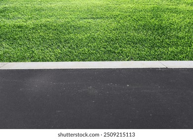 laying of sidewalks with new asphalt. Curbs enclosing the lawn, grass - Powered by Shutterstock