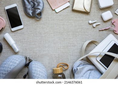 Laying Travel Luggage Ready To Plane On Copyspace Textured Canvas Background Top View. Female Bag With Personal Accessories Of Passenger Airplane For Tourism. Preparing To Trip Vacation