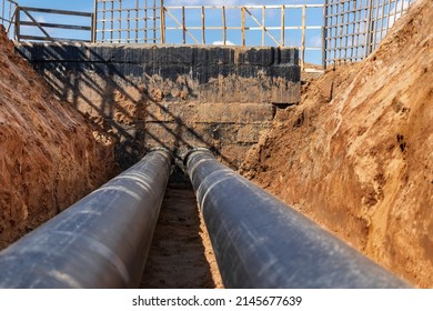 Laying Of Underground Pipes In Concrete Chamber. Installation Of Water Main At The Construction Site. Construction Of Stormwater Pits, Sewerage Valve, Sanitary System And Pump Station