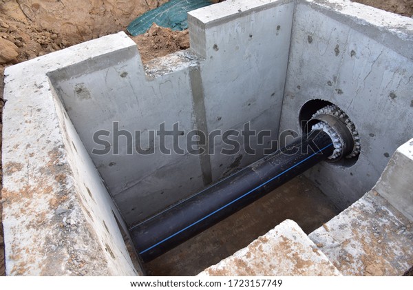 Laying of underground storm sewer pipes in\
concrete chamber. Installation of water main at the construction\
site. Construction of stormwater pits, sewerage valve, sanitary\
system and pump\
station\

