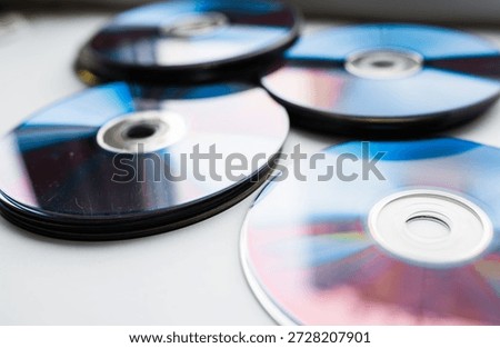 Layout of of CD and DVD discs on a white background top view. Physical media concept.