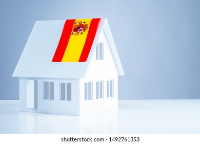 The Layout Of The Cottage With The Flag Of Spain On The Roof. Buy Timeshare In Spain. Accommodation In Europe. Acquisition Of Real Estate In Madrid. Immigration. Emigration. Move.