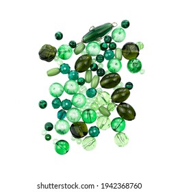 Layout Of Green Plastic And Glass Beads Of Different Sizes And Shapes, Isolated On A White Background. Diversity Of Green And Emerald Beads.