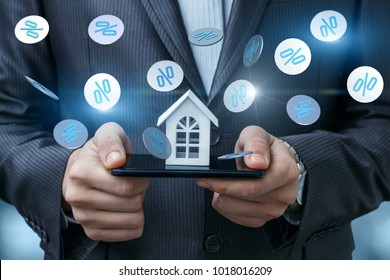 Layout of the house in the phone and fly interest. The concept of discounts on real estate.