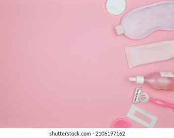 Layout Of Items For Face And Body Care On A Pink Background, Cleansing Gel, Serum, Razor, Mask, Cotton Pad, Balm, Wax Strip, Pink, Copy Space