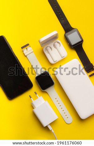 Layout of modern gadgets on a yellow background . Online communication. Internet connection. Mobile communication. 5g. Black and white technology. Modern technologies. Copy space