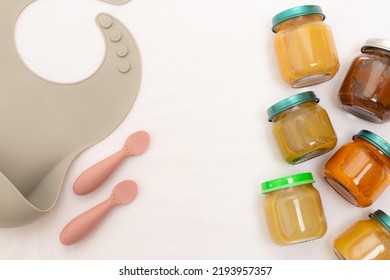 Layout of Puree for baby food with vegetables and fruits. Selective focus. nutrition. The first complementary feeding of the child. A happy child. A well-fed child. Copy space. Article about baby food