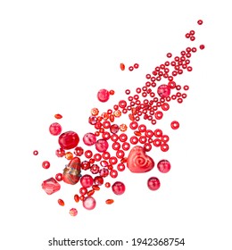 Layout Of Red Beads And Marbles Isolated On A White Background Diagonaly In The Shape Of A Falling Drop. Concept Of Diversity Of Red Beads Of Differet Shapes, Materials And Sizes.