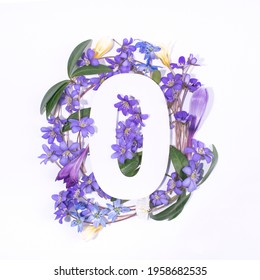 Layout with spring flowers and number zero. Flat lay. Top view.