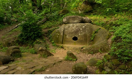 LAZAREVSKOE, SOCHI, RUSSIA - MAY, 29, 2021: Mamedovo Canyon or Berendeevo Tsarstvo. Big dolmen in the forest. Historical ritual building