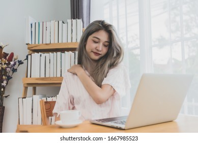 Lazy bored asian woman using laptop in the morning. - Shutterstock ID 1667985523