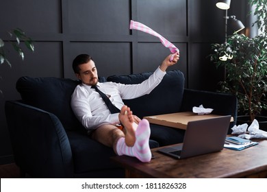 Lazy Businessman Without Pants Is Working From Home. Funny Concept Of Distant Work During Isolation.