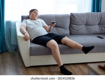 Lazy Child Boy Sit Watching Tv At Home, Passive Overweight Teenager Spend Time Doing Nothing