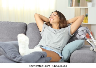 Lazy disabled woman resting happy sitting on a couch at home