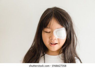 Lazy Eye Amblyopia In Children.Eye Care.Little Asian Girl Covered Up With A Special Patch Online Learning At Home.Occlusion Therapy Using An Eye Patch.Children Care.child Online Learning Education.