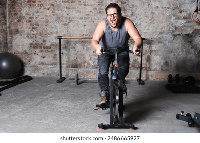 Lazy fat man doing fitness in the gym. - Powered by Shutterstock