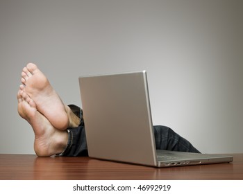 Lazy man in an office with a computer
