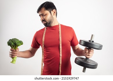 Lazy Man With Unhappy Upset Face Hate To Eat Broccoli And Exercise