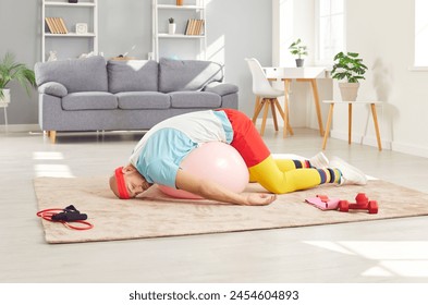 Lazy or tired funny man wearing retro sportswear is sleeping on the floor during a home workout training. His humorous approach to fitness is evident in nap during gym time at home. - Powered by Shutterstock