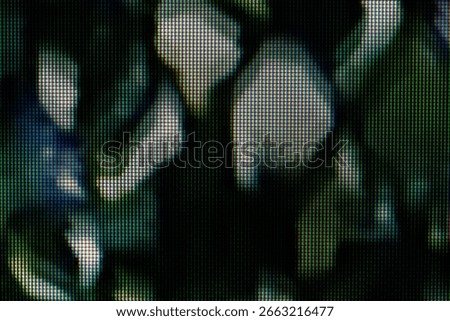 An LCD screen macro of RGB subpixels forming pixel grid over dark blurred organic green plant leaves, abstract digital tech background computer monitor pattern, magnified electronic display texture