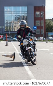 L-driver Motorcyclist Doing Exercises With Cones On Asphalt Ground