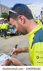 LE MANS, FRANCE - JUNE 11, 2017: Famous English Racer Darren Turner Gives Autograph On His Photo For Fans During Parade Of Pilots Racing