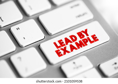 Lead by Example - means to to show others how to behave or act by doing it yourself, demonstrating it through your own actions, text button on keyboard