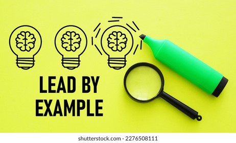 Lead by Example is shown using a text and picture of lamps
