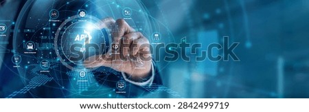 A lead developer handhold API integration. Tech engineer using workstation connecting microservices and data pipelines on a dual screen. Software architecture and scalable cloud networks.