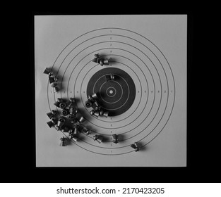 Lead Pellets For Air Rifle And Paper Target Isolated On Black  