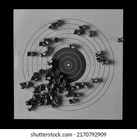 Lead Pellets For Air Rifle And Paper Target Isolated On Black  