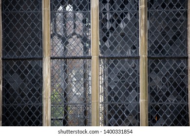 Leaded windows with stonework frames to historic ecclesiastical thirteenth century building