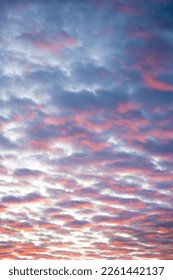 Leaden sky filled with clouds filled with the setting sun. Perfect background, purple orange